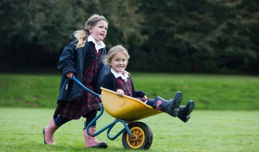 child in a wheelbarrow