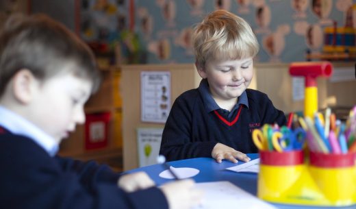 young students at the school table