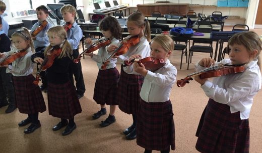 Children playing violin