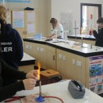 Students in the science lab working on experiments