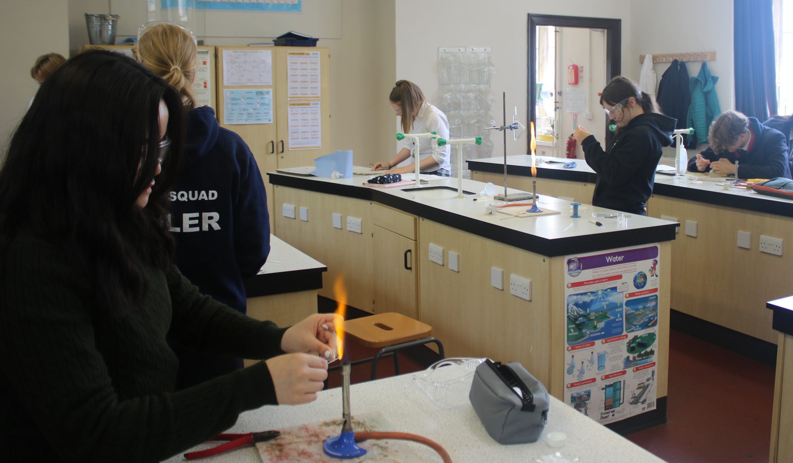 Students in the science lab working on experiments