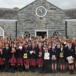 students in a group with their animal and insect books