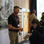 man from the army talks to students