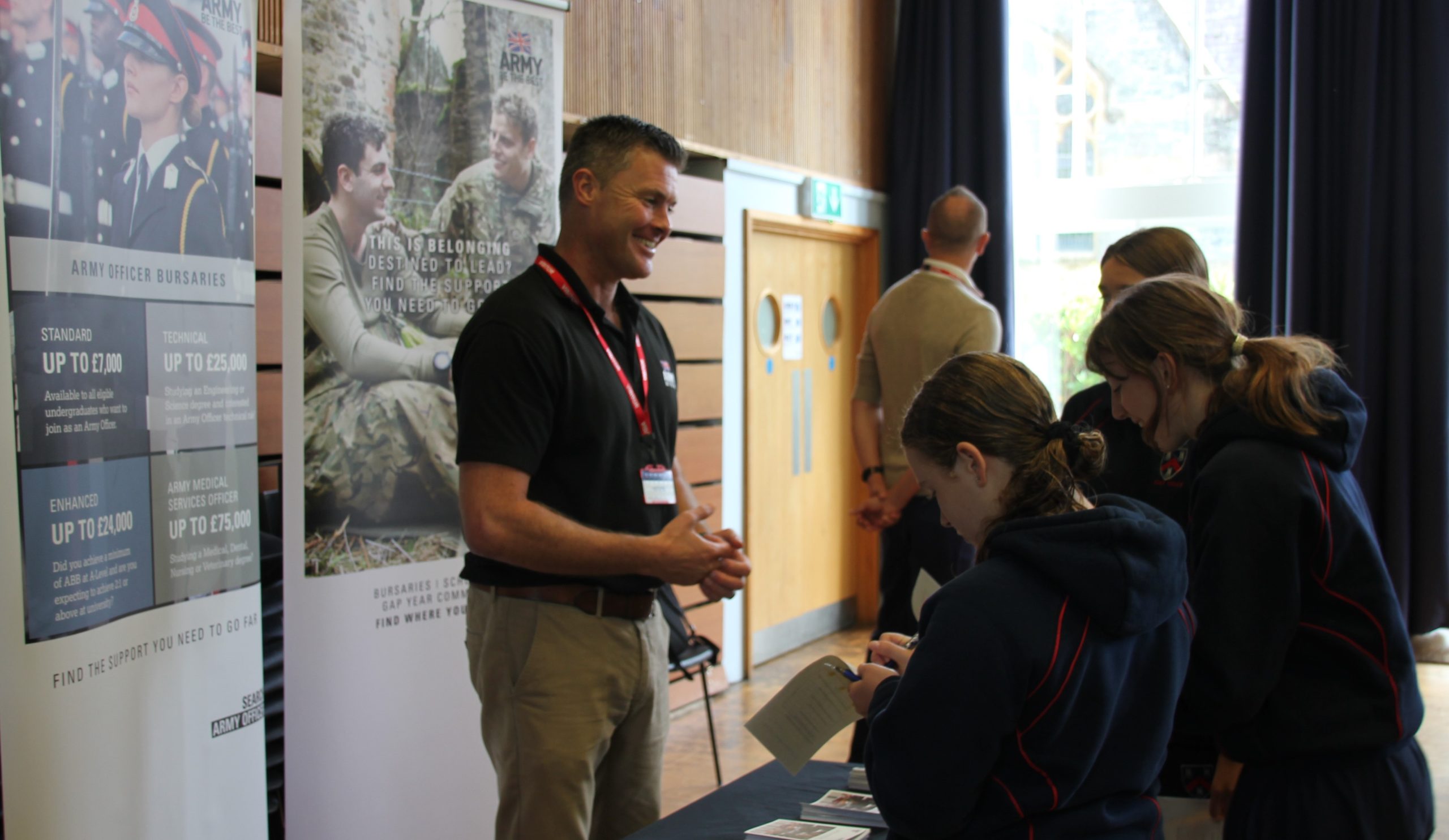 man from the army talks to students