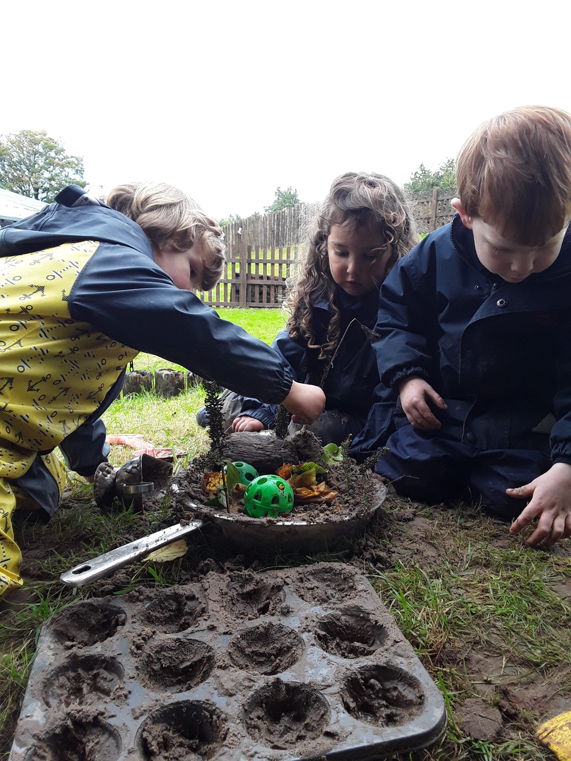 students working on their gardening