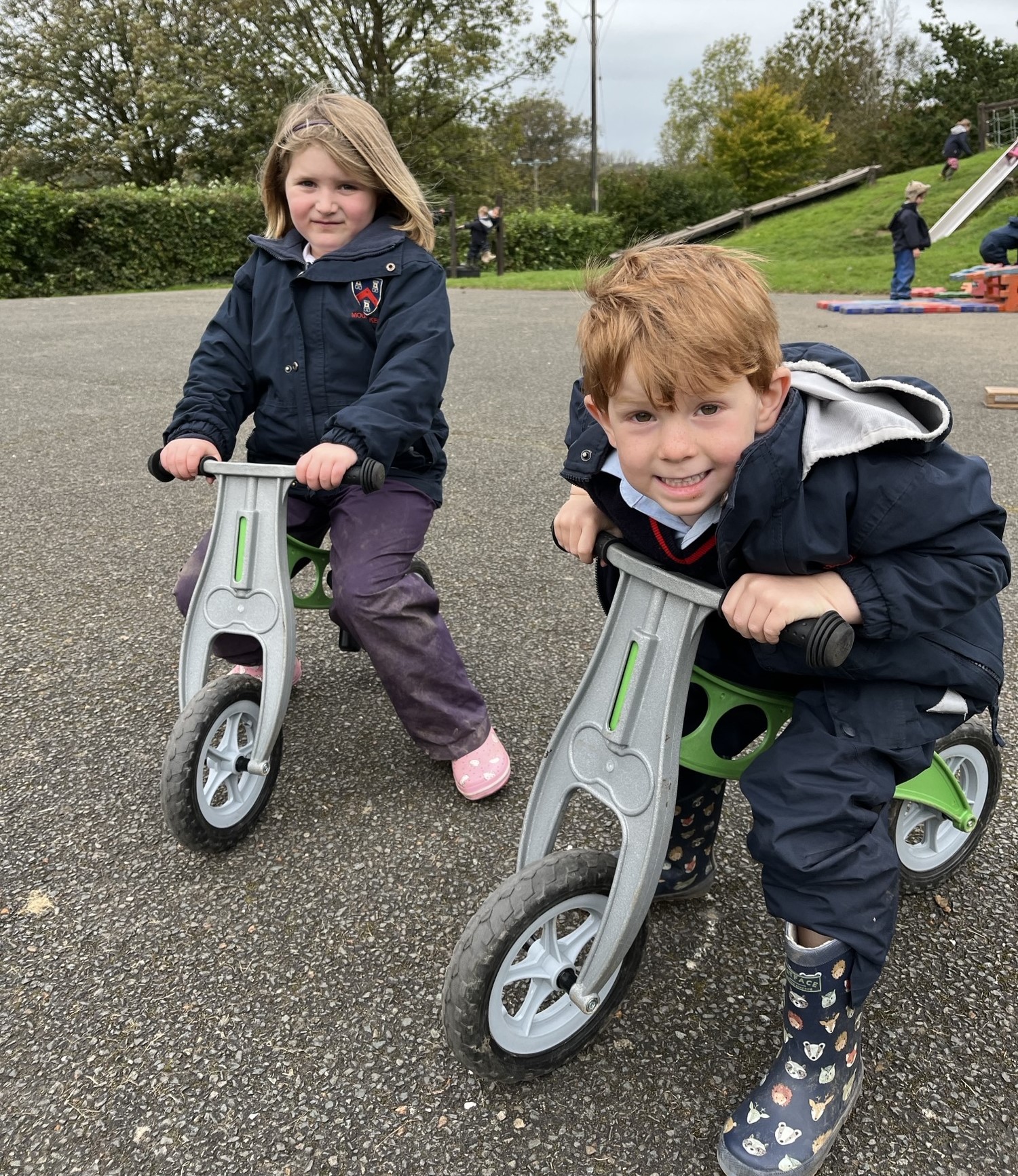 2 students on trikes