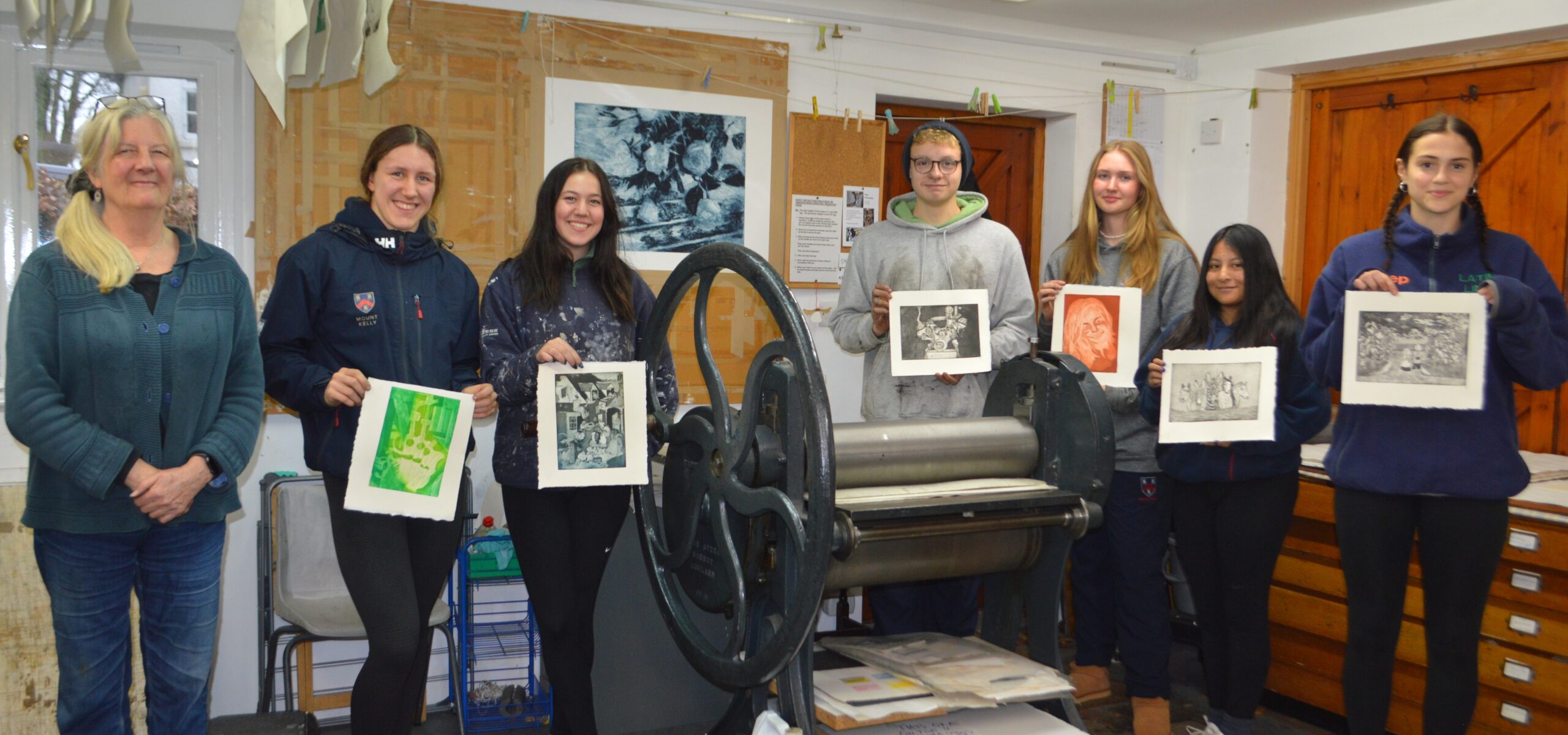 Students holding images