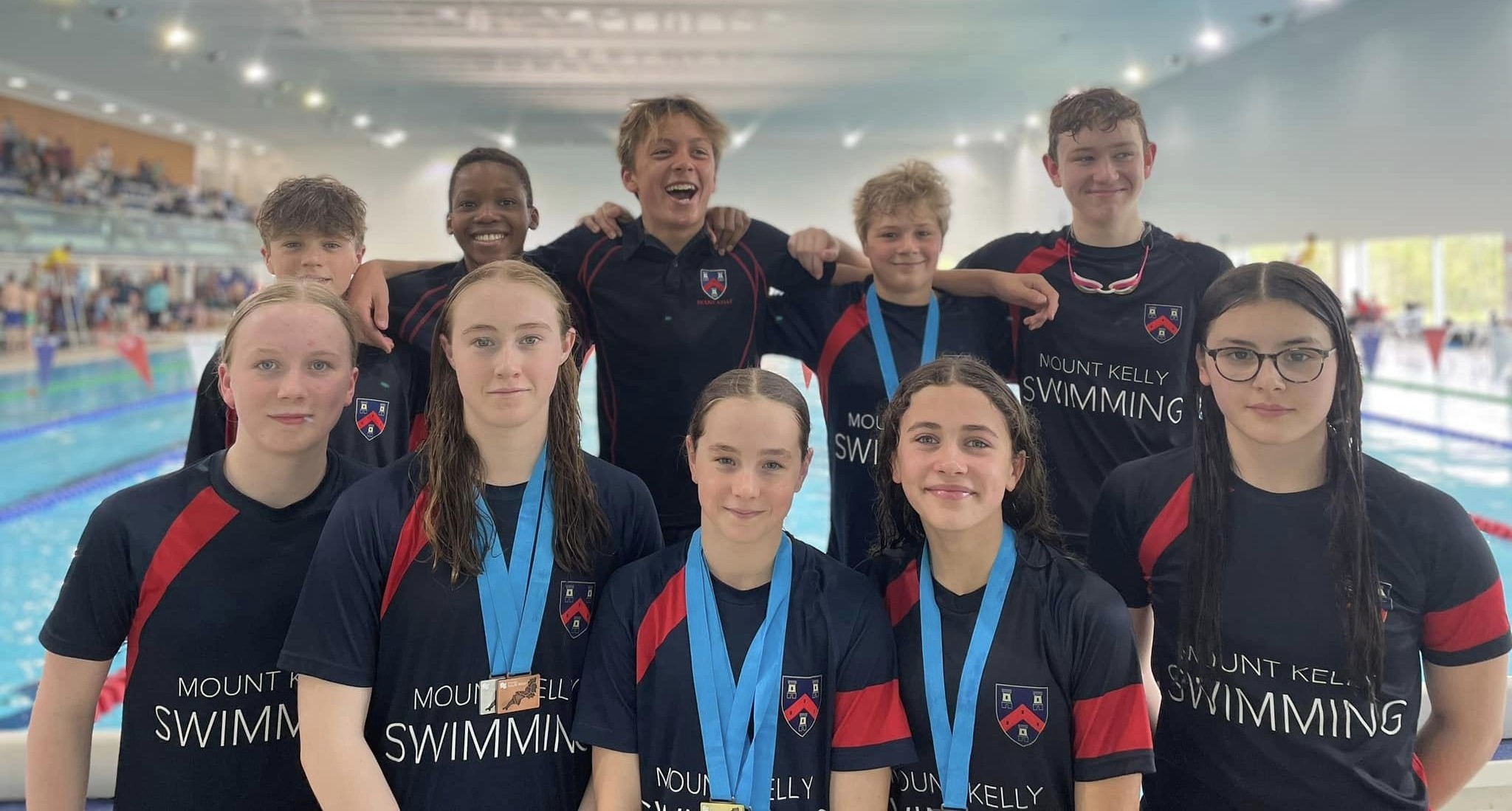 swim students with medals
