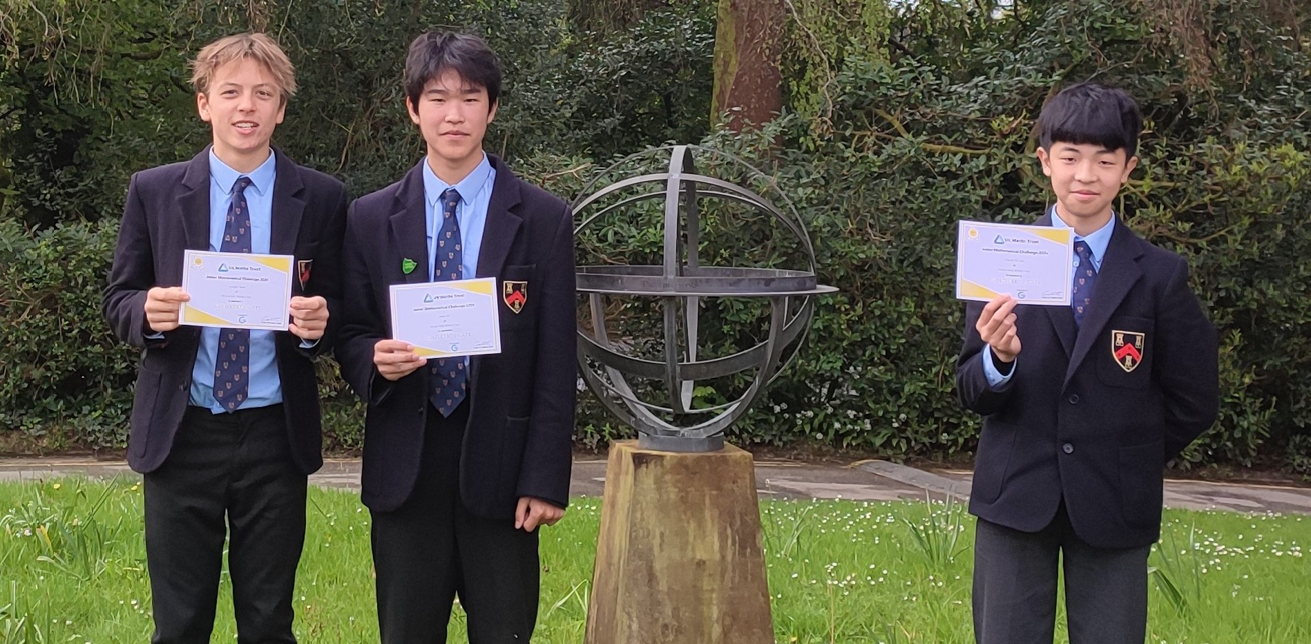 students holding certificates