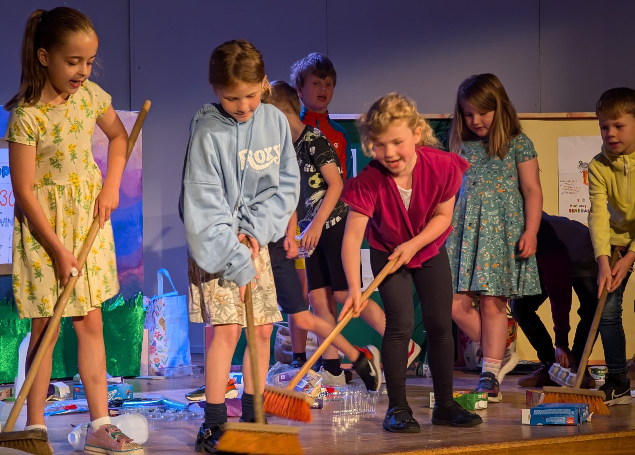 pre-prep students brushing the floor
