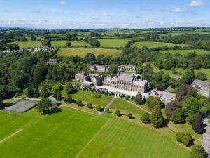 Aerial view of the College at Mount Kelly School, surrounded by sports pitches and fields