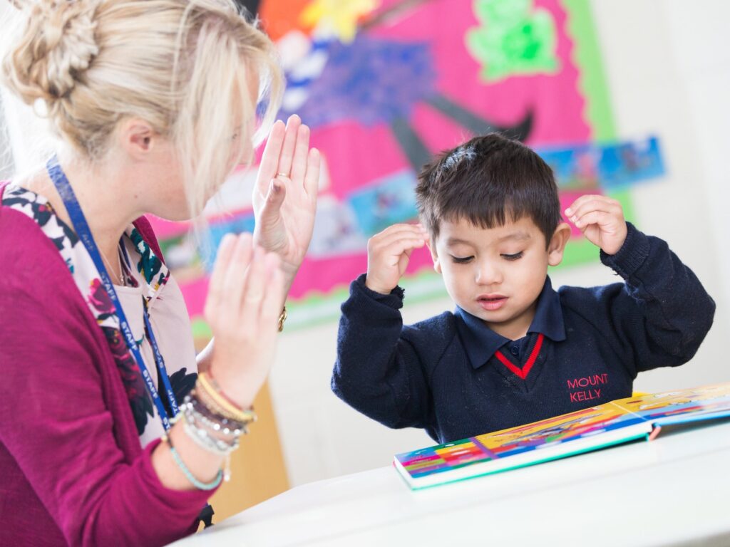 student and teacher working together