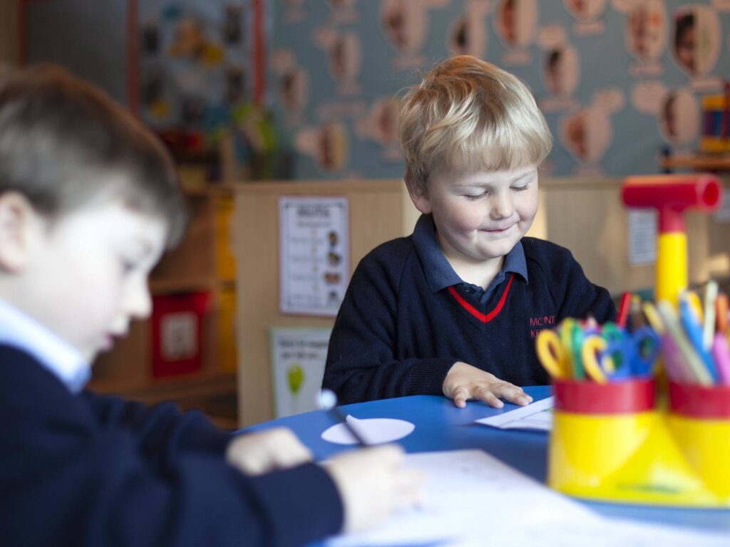 young students at the school table