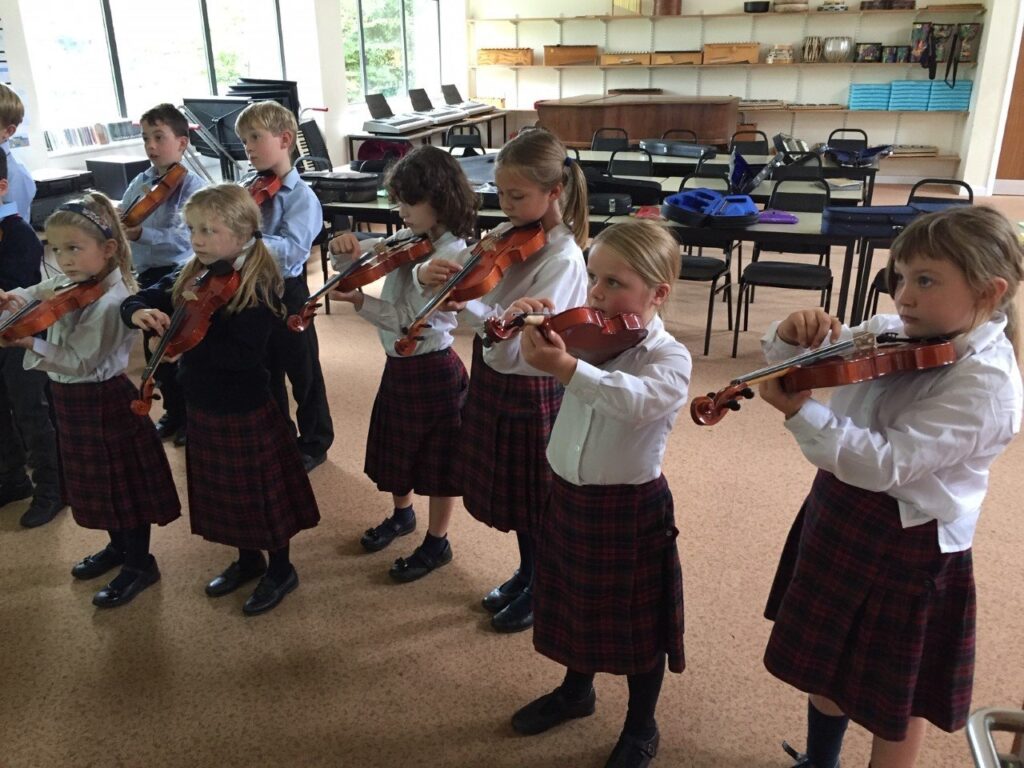 Children playing violin