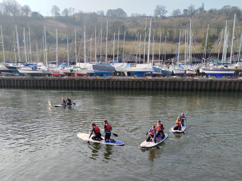 students on paddleboards