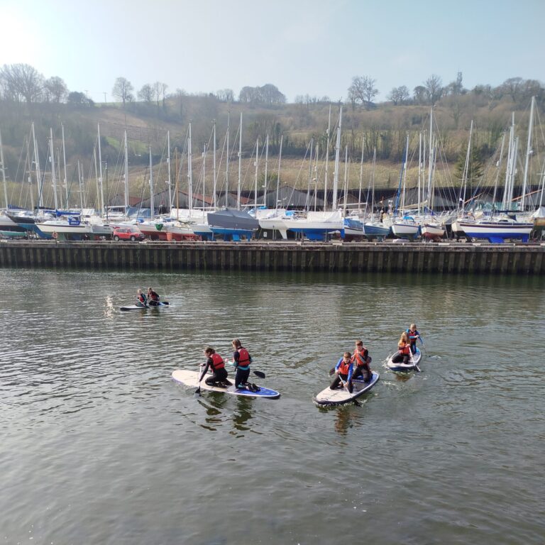 students on paddleboards