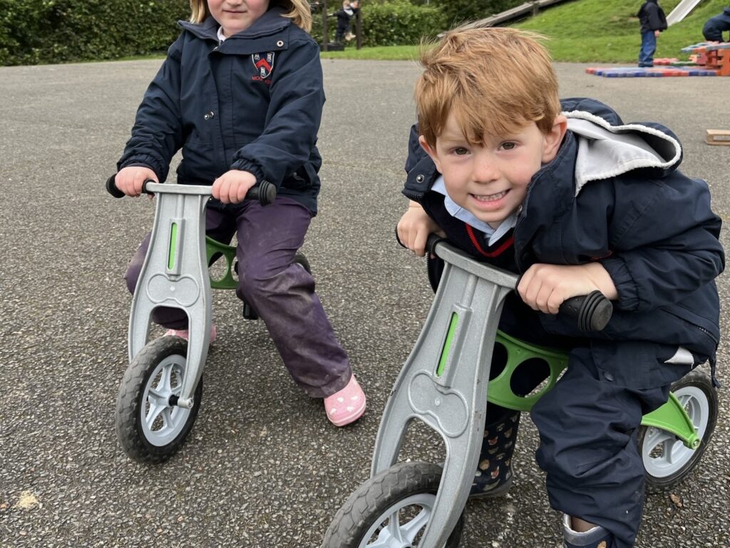 2 students on trikes