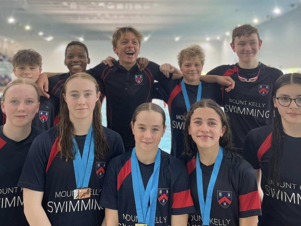 swim students with medals