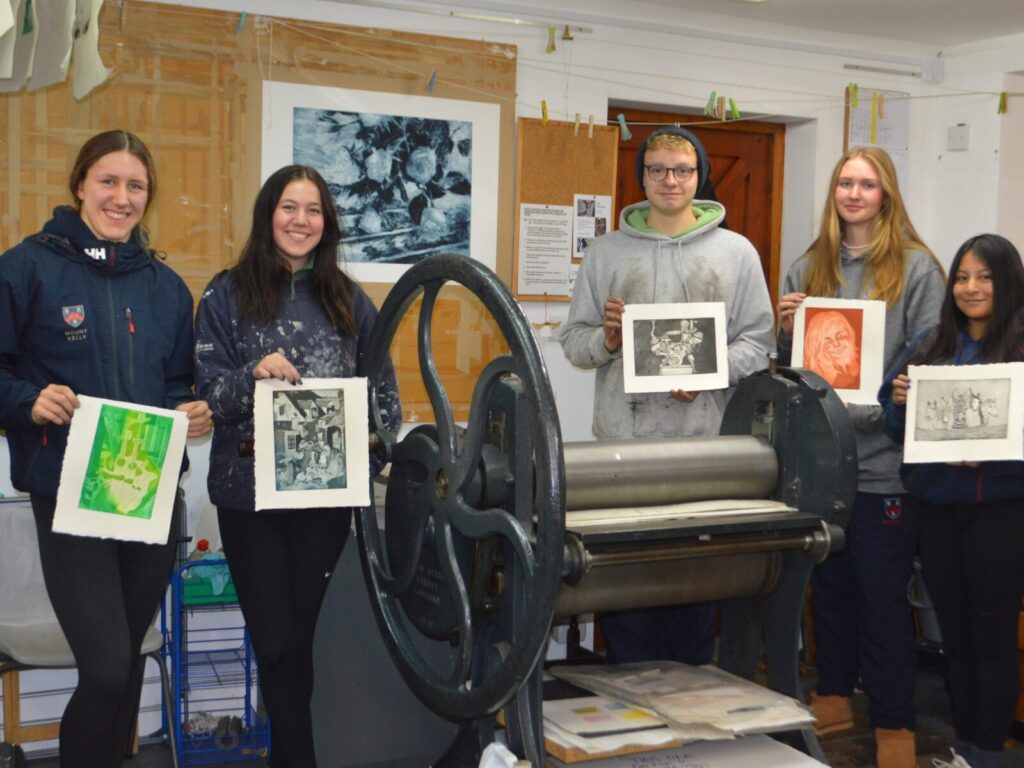 Students holding images